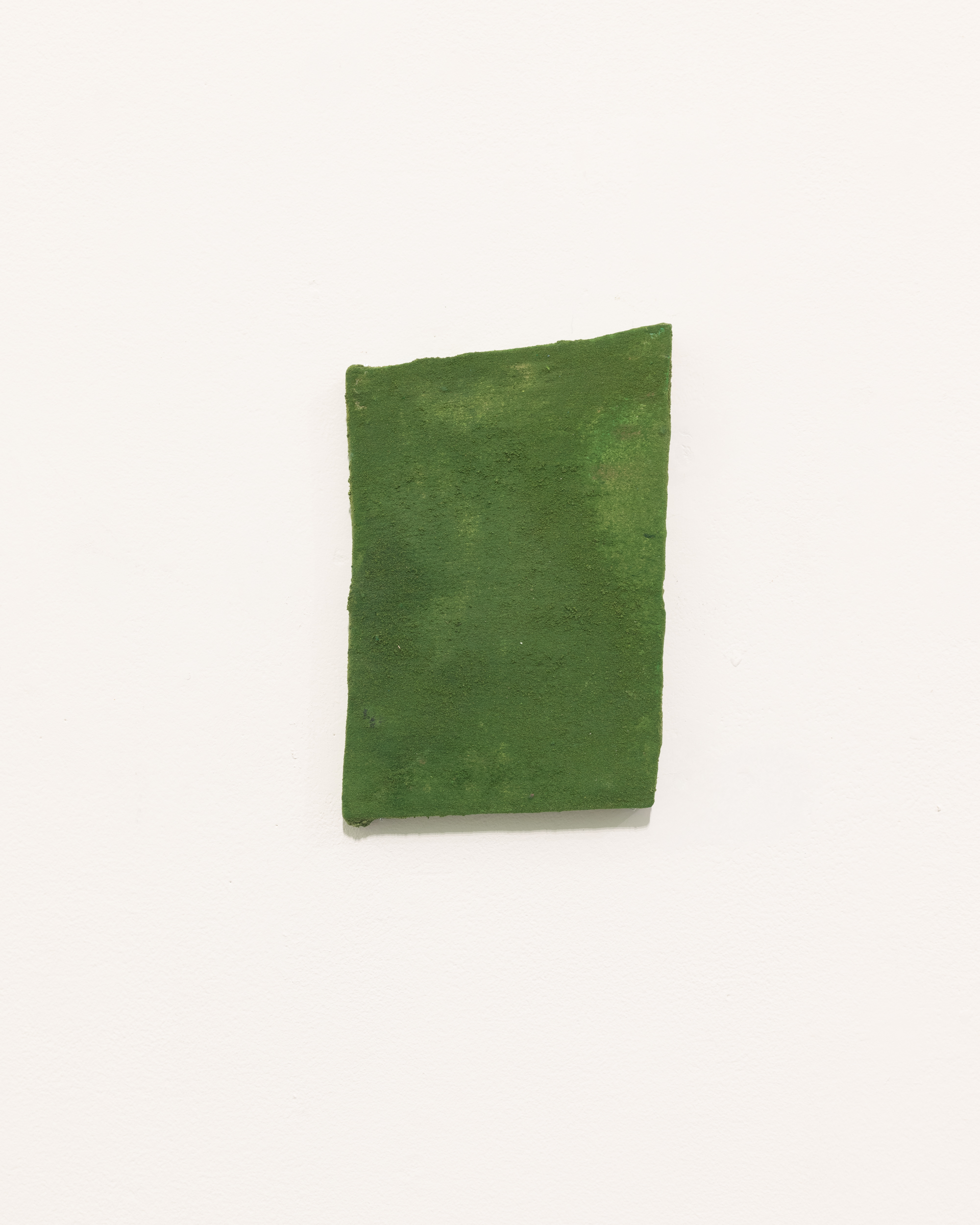 Installation views thesis exhibition containing colorful paintings stretched and unstretched, hanging in space and attached to the wall
