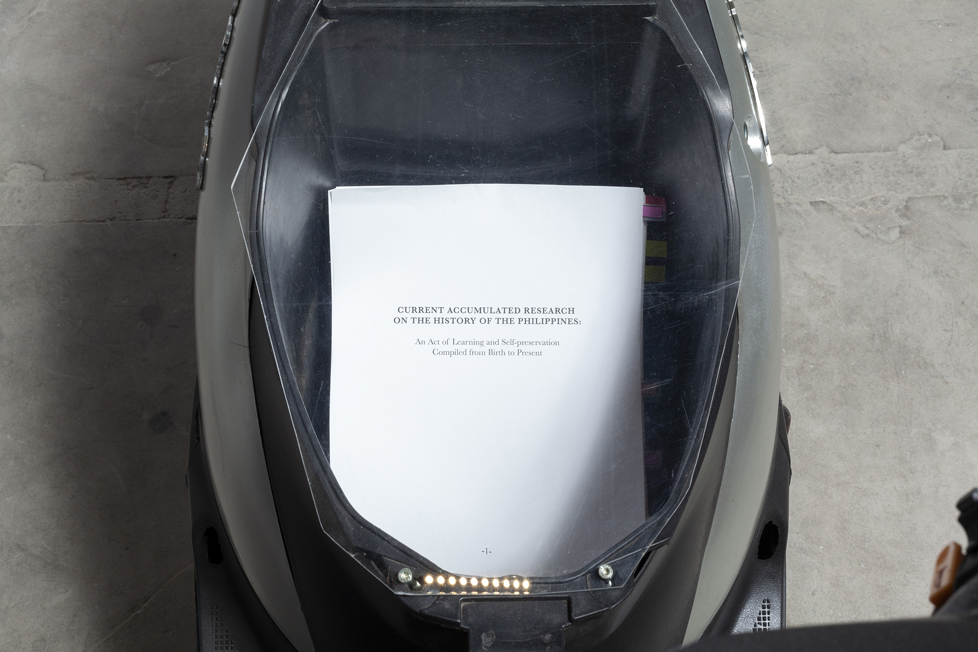 Detail image of the scooter’s storage compartment.
