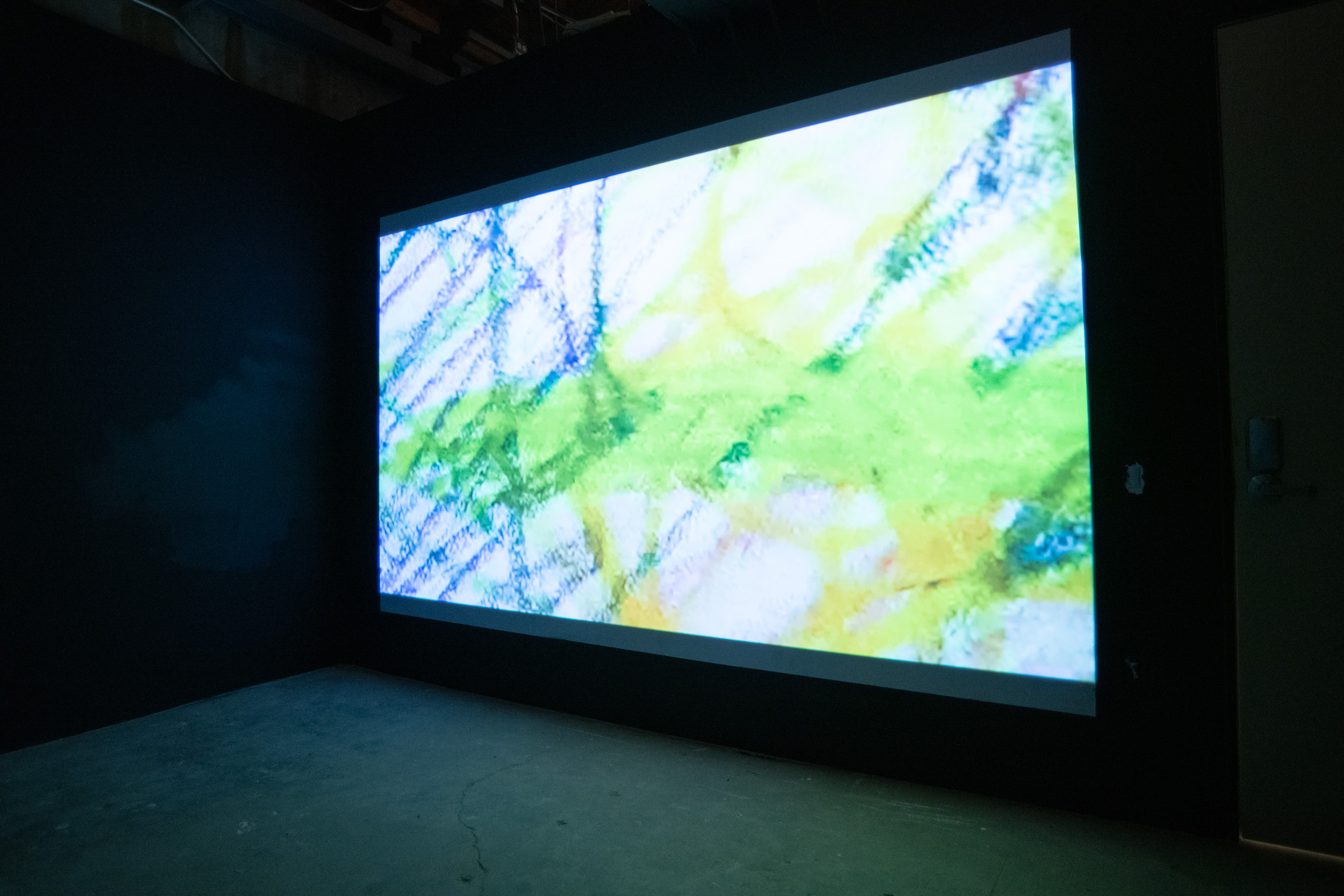 Two channel video is installed on opposing walls in a dark room with black walls. One screen is of a figure trying to fall asleep, rolling in bed at different points of view with multicolored lights and the other channel is of different scanned drawings scanning over the surface. After two minutes, the two channels frantically oscillate between the opposing walls causing an almost strobe light effect. The work ends with the artist laying in bed.
