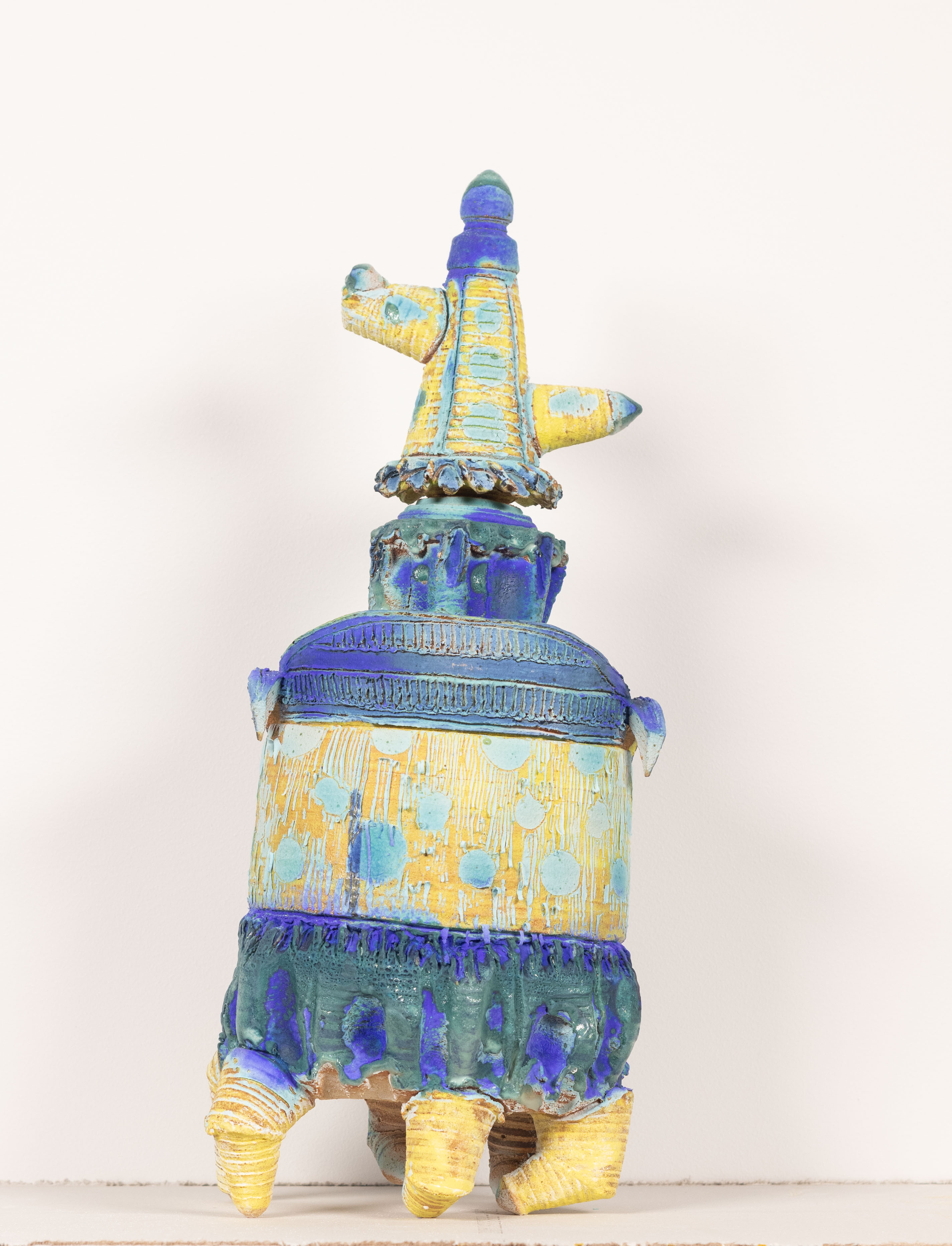 4 figures comprised of wheel thrown elements that stack together. Each has a distinct glaze
pallet with dry and wet glazes mixing.