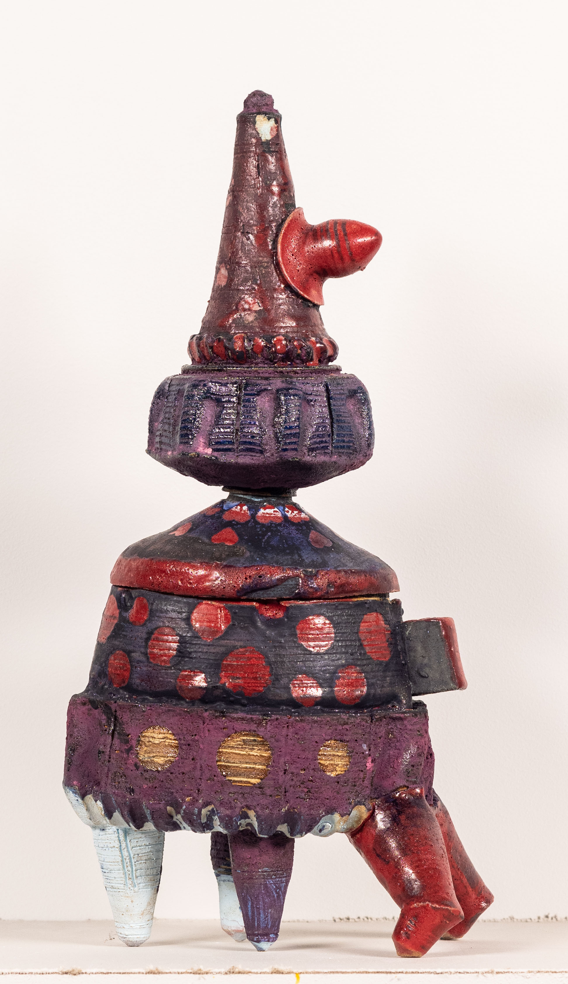 4 figures comprised of wheel thrown elements that stack together. Each has a distinct glaze
pallet with dry and wet glazes mixing.
