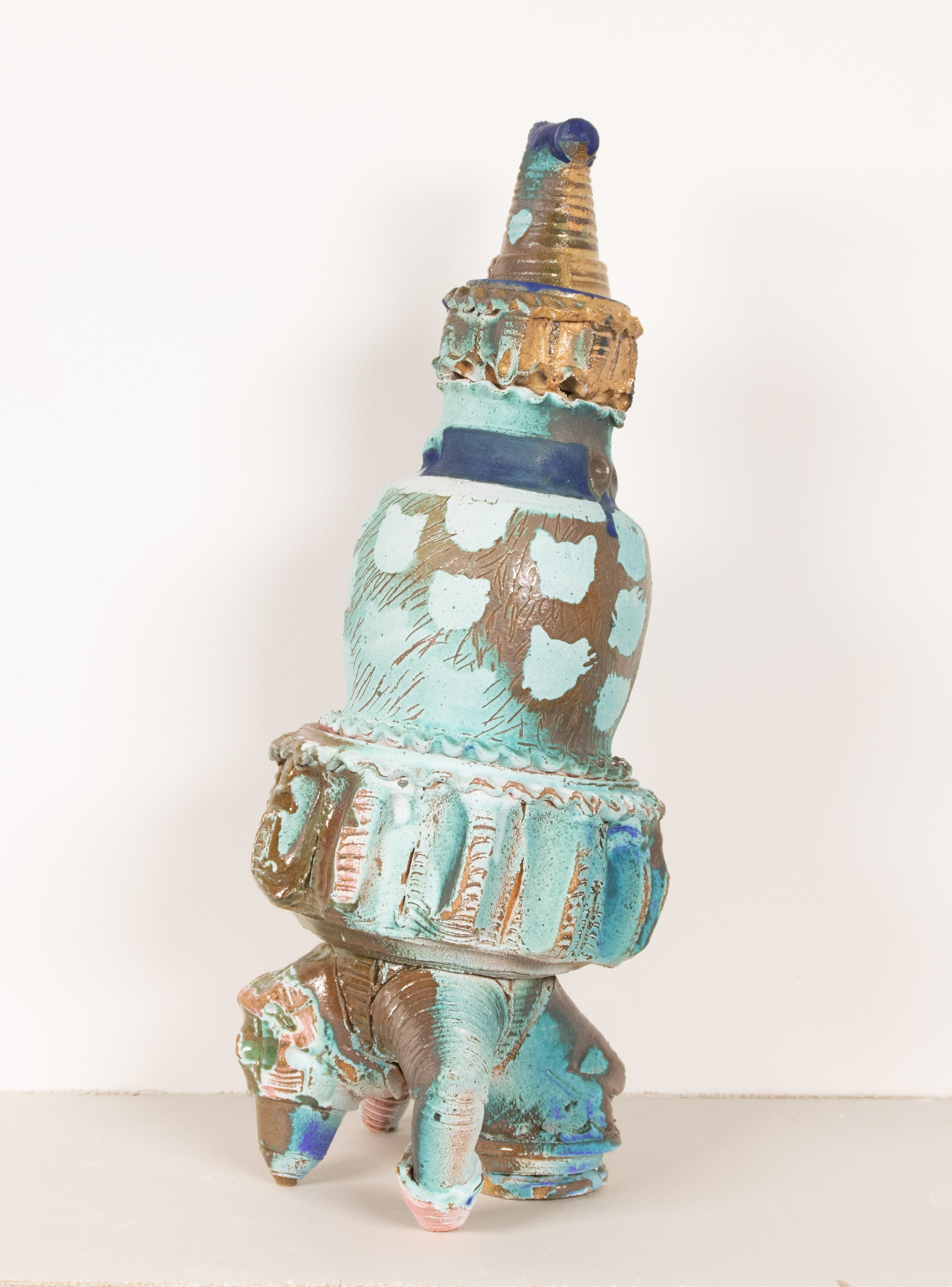 4 figures comprised of wheel thrown elements that stack together. Each has a distinct glaze
pallet with dry and wet glazes mixing.